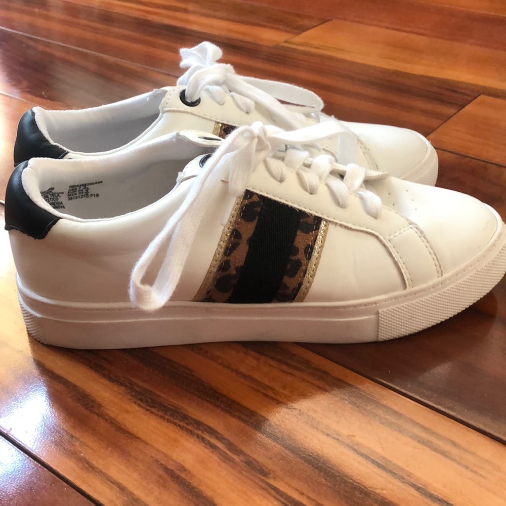 Lightly worn white sneakers with cheetah stripe